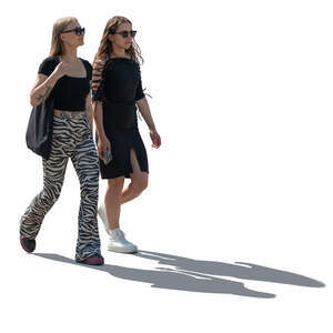 two young backlit women walking