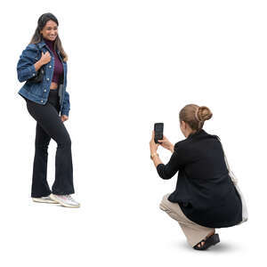 woman taking a picture of her girlfriend