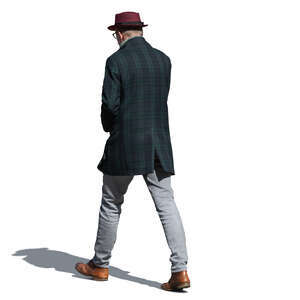 man with an overcoat and a hat walking