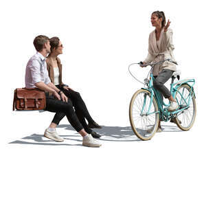 woman with a bike talking to two friends sitting