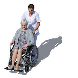 nurse pushing a woman in a wheel chair seen from above