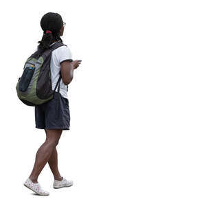 black woman with a backpack walking