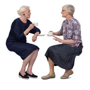 two older ladies sitting and drinking coffee