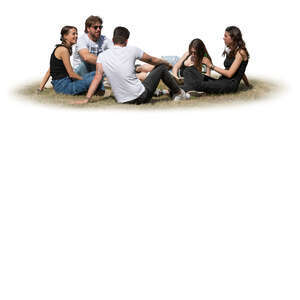 group of young people sitting outside on the grass