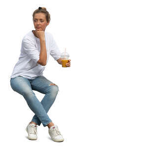 woman sitting and drinking juice