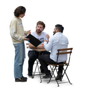 two men sitting in a cafe and talking to a waitress