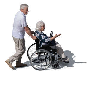 top view of a man pushing a woman in a wheelchair