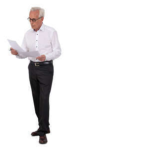 older businessman standing and reading some papers