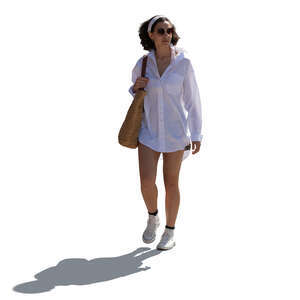 backlit woman in summer walking