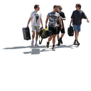 backlit group of men with heavy bags walking