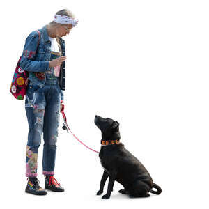 woman standing and talking to her dog