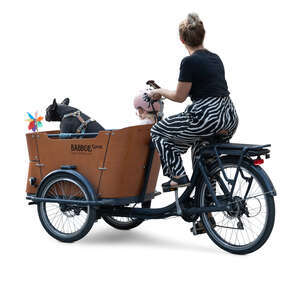 woman riding a cargo bike with a little girl and a dog sitting in the box