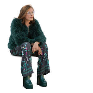 woman in a green furry jacket sitting