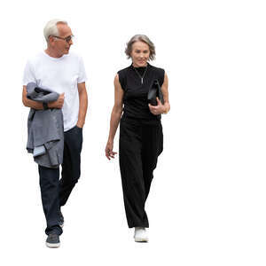 grey haired couple walking
