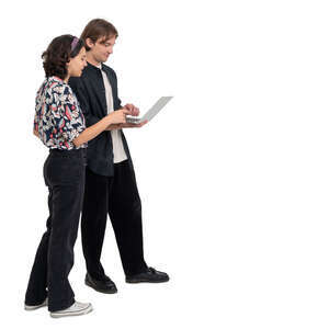 young man and woman standing and looking smth from a laptop