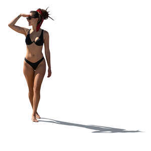 backlit woman in bikini standing and looking at smth