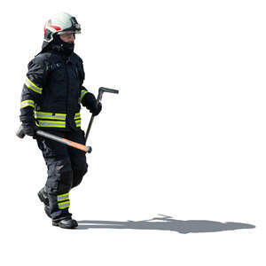 firefighter carrying tools walking