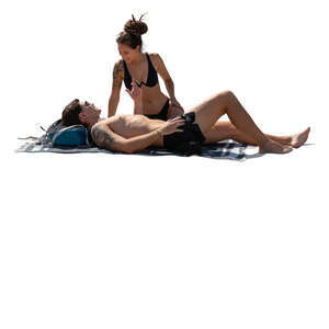 couple sunbathing on the beach