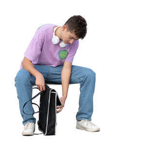 young man with a backpack sitting