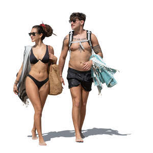 man and woman in bathing suits walking on the beach