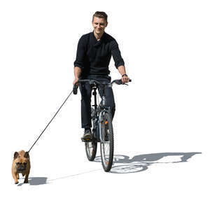 man riding a bike with a dog running beside him