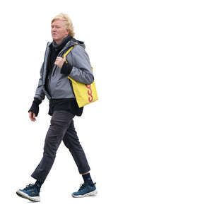 man with a yellow canvas bag walking