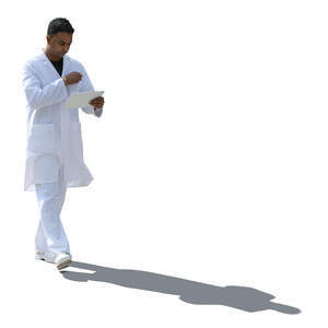 backlit indian doctor walking