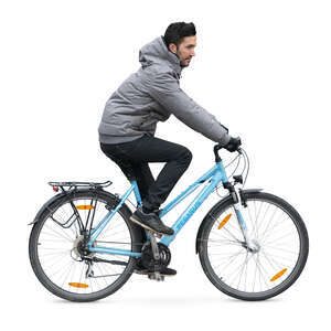 man in a grey jacket riding a bike