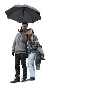 man and woman with an umbrella standing seen from below