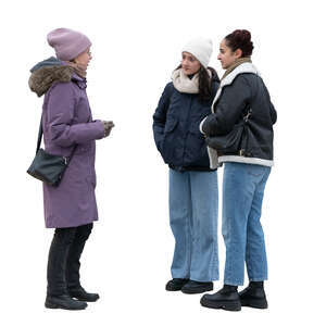 three women standing outside in winter and talking