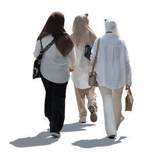 backlit group of muslim women walking