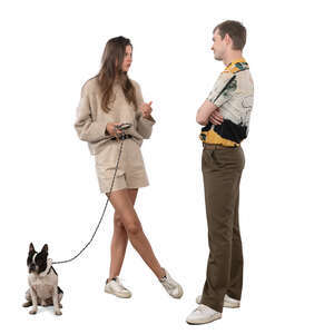 woman with a dog standing and talking to a friend