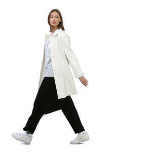 woman in a white coat walking hastily