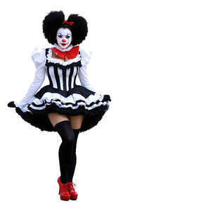 female clown in a clown costume standing