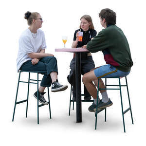 group of three people sitting at the bar and talking