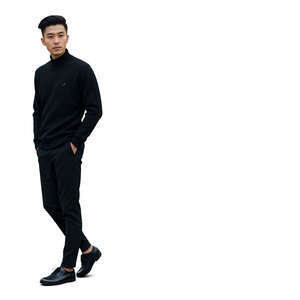 asian man in black clothing walking