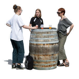 three women standing in a casual outdoor bar