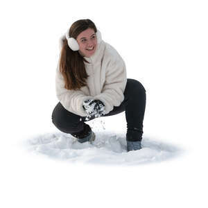 woman making snowballs in the snow for snow fight