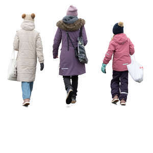 woman and two girls in winter walking