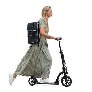 woman in a long summer dress riding a scooter