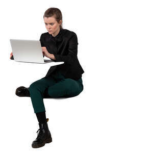 woman sitting at the table and working with computer