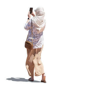 cut out arab woman standing and taking a picture