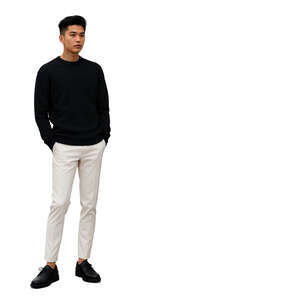 young asian man standing hands in pockets