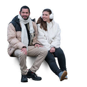 man and woman in winter sitting