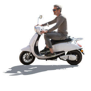 cut out backlit grey haired man riding a white motor scooter