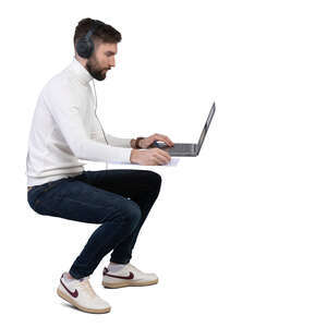man with headphones working with computer