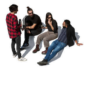 group of four people sitting and drinking mate tea seen from above