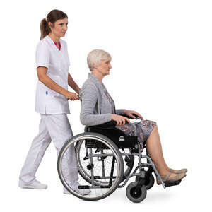 nurse pushing an elderly woman sitting in a wheelchair