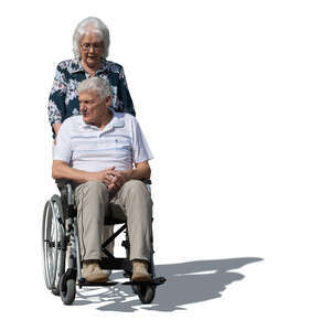 woman pushing an older man sitting in a wheelchair