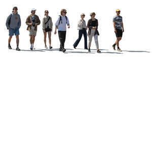 group of backlit young people walking